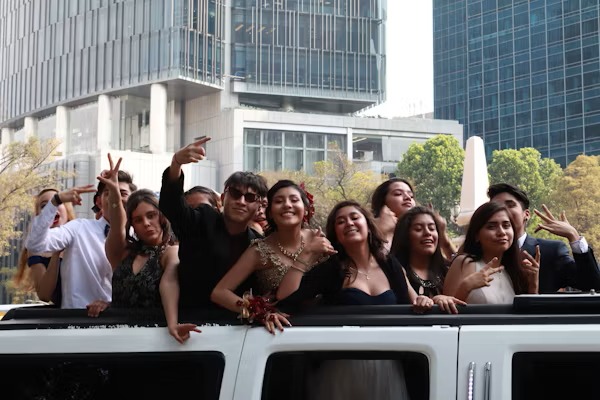 Happy customers enjoying luxury limousine service from logisticsflowhub.pro during a memorable event.