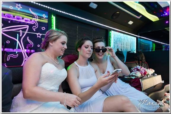 Happy customers enjoying luxury limousine service from logisticsflowhub.pro during a memorable event.